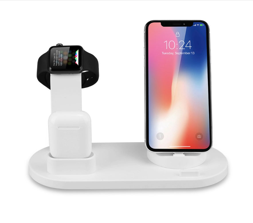 White multi-device charging stand with smartwatch and smartphone on a white background