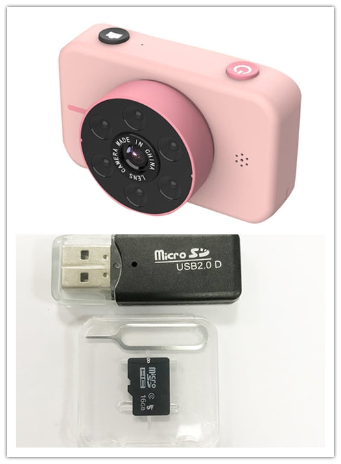 Pink digital camera with USB stick, microSD card, and sim card on a white background