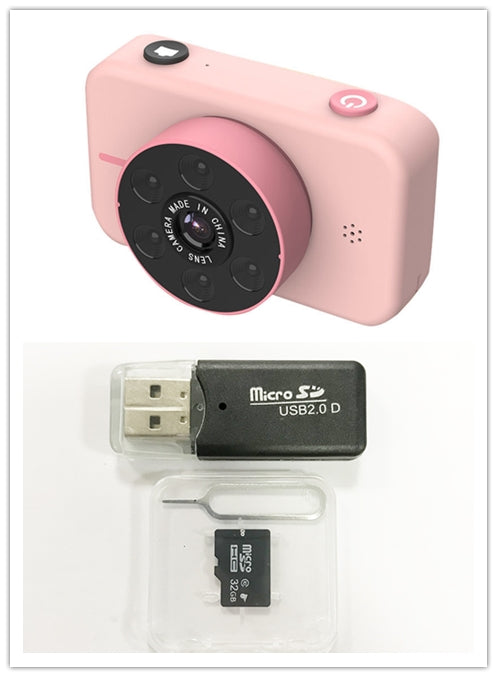 Pink digital camera with USB adapter and microSD card on a white background