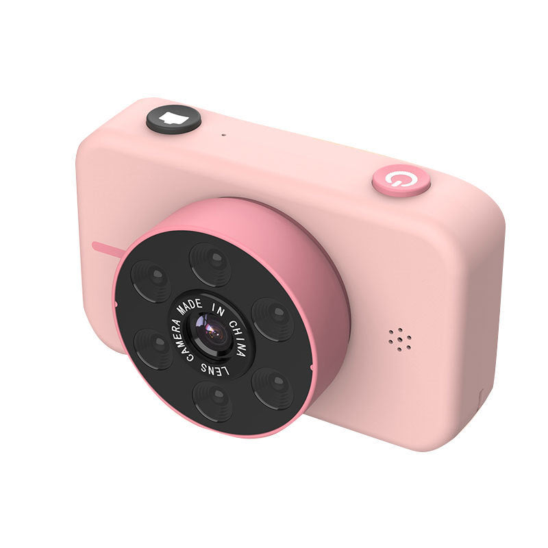Pink digital camera with black buttons on a white background