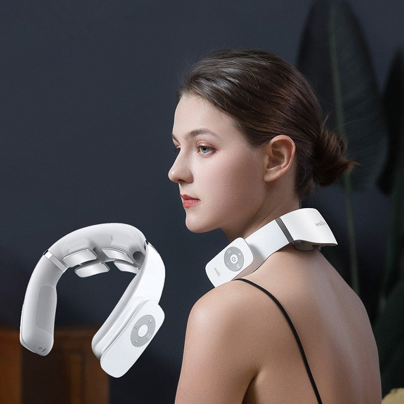 Woman wearing a white neck and shoulder massager against a dark background