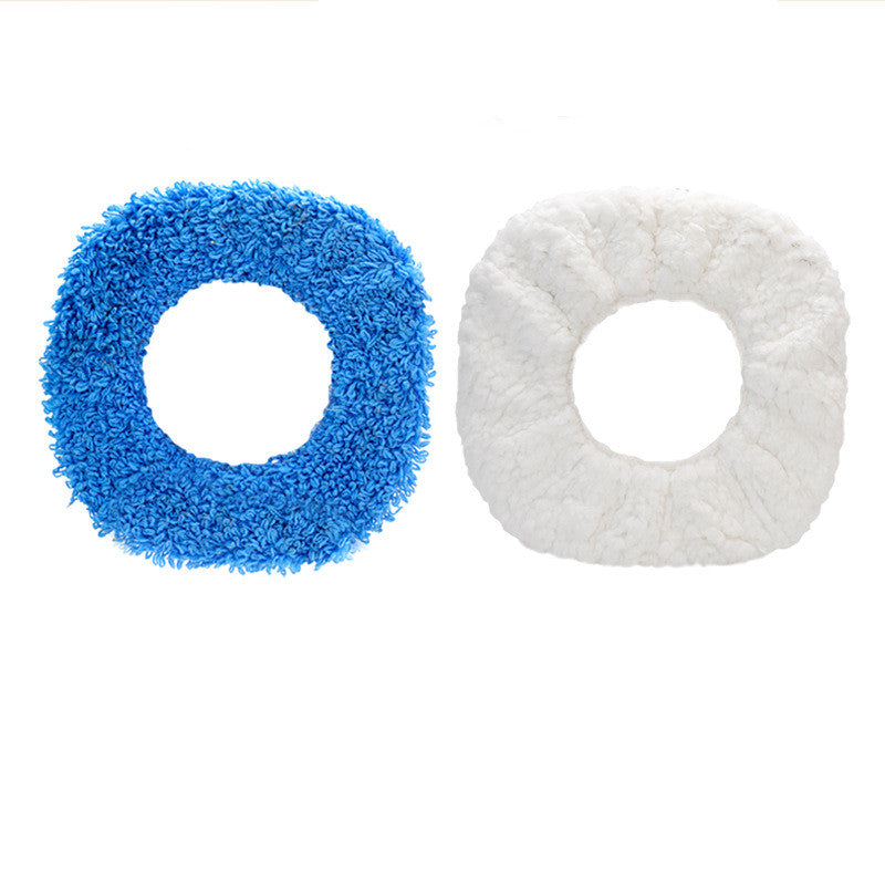 Blue and white circular cleaning pads on a white background