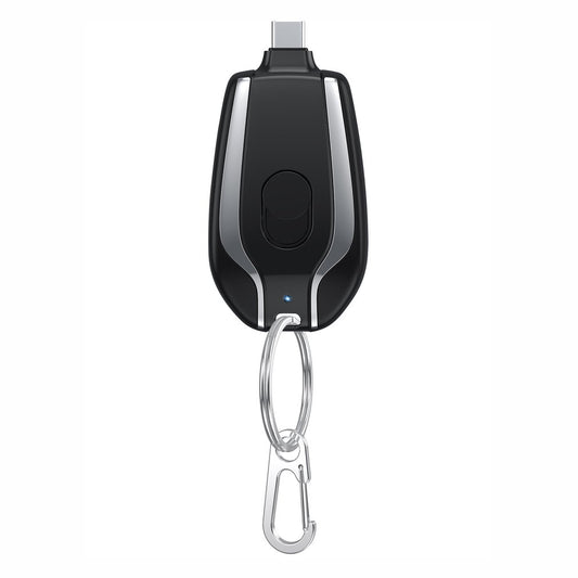 Black and silver keychain device with a carabiner on a white background