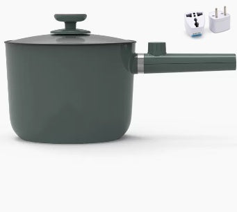 Green saucepan with a lid on a white background