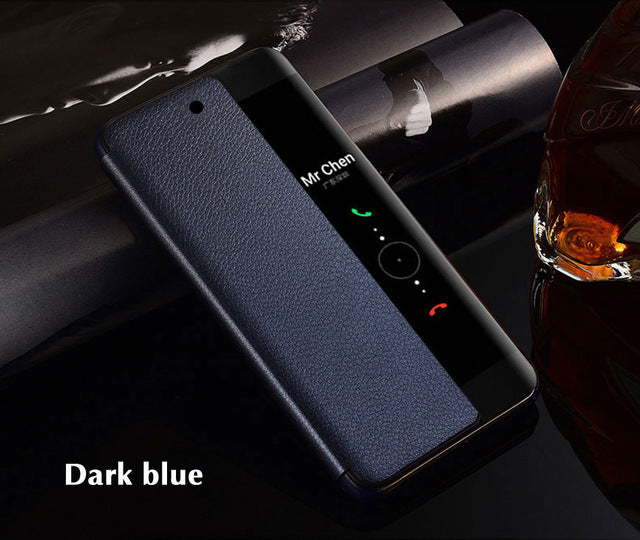 Dark blue phone case on a phone with a glass of whiskey in the background