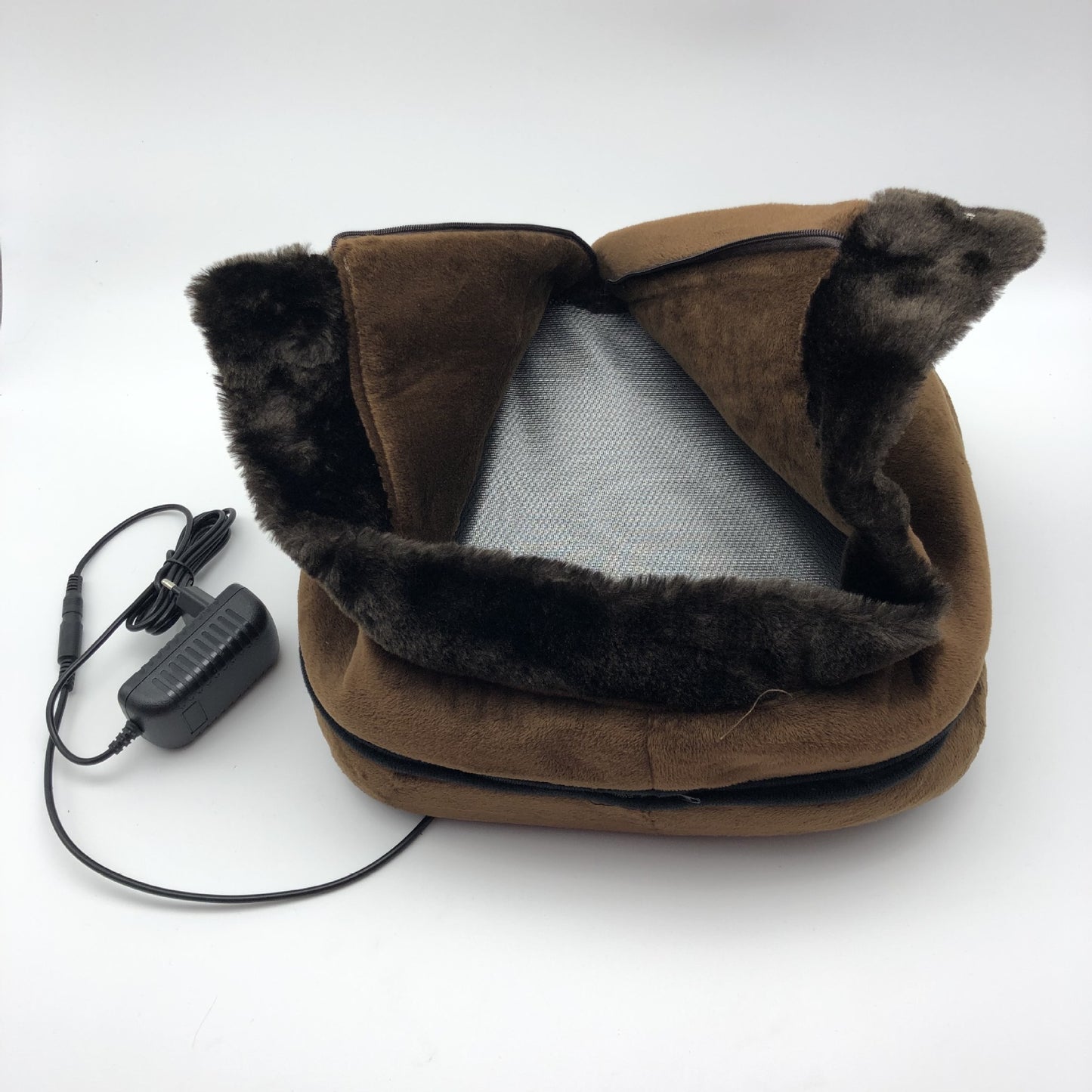 Brown heated neck pillow with fur trim and power adapter on a white background