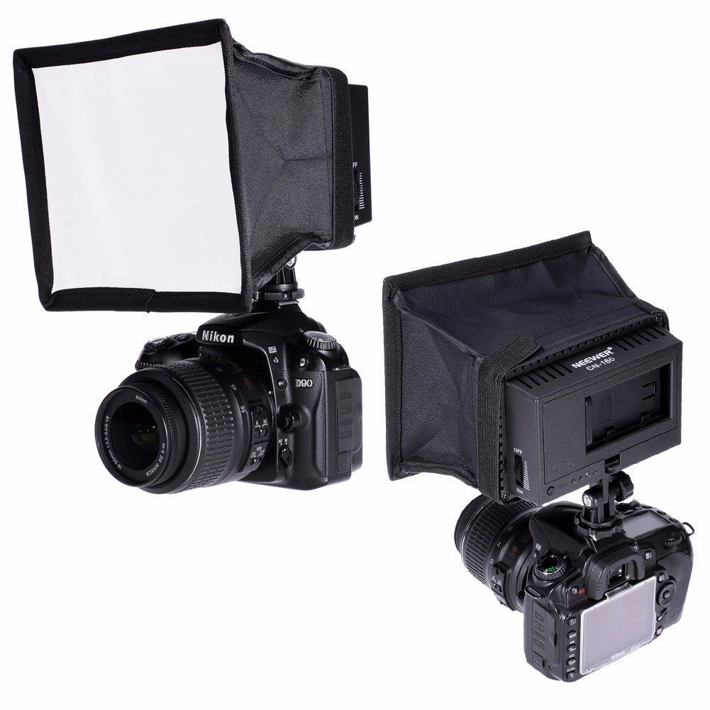Camera with softbox and flash unit on a white background