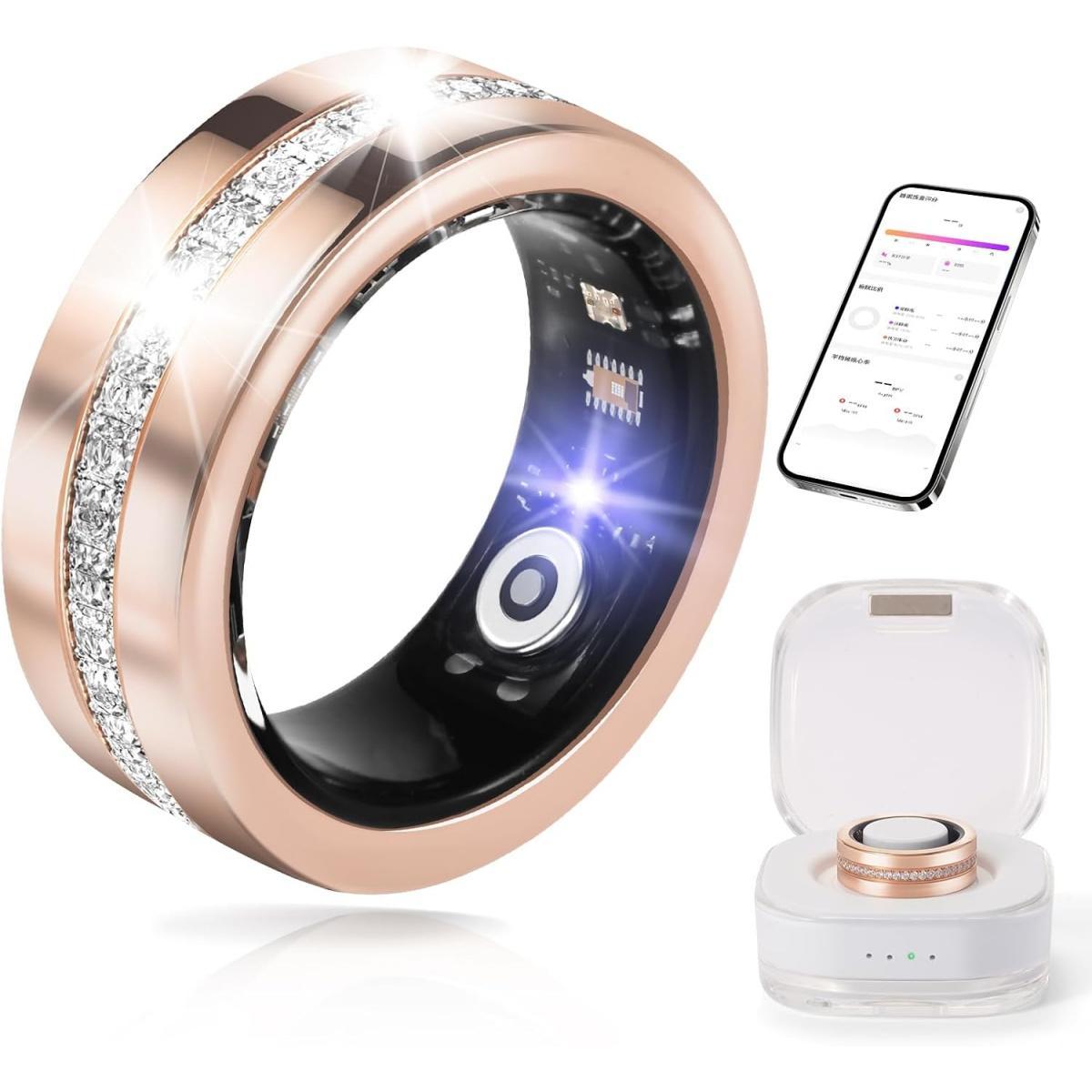 Smart ring with rose gold band and digital display, next to a charging case and smartphone app.