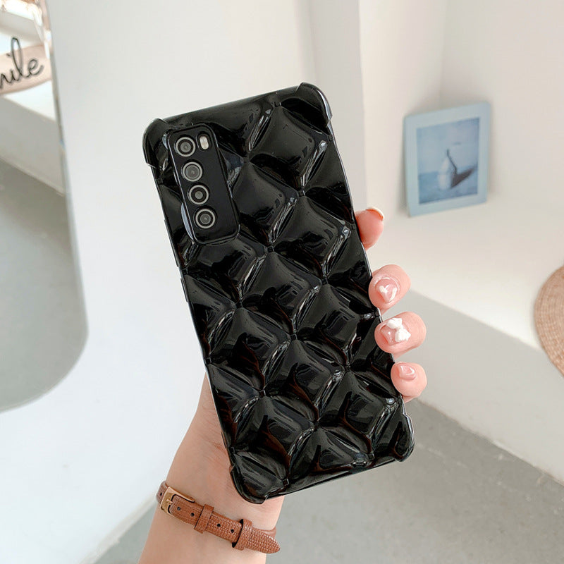 Person holding a black quilted phone case with a minimal background