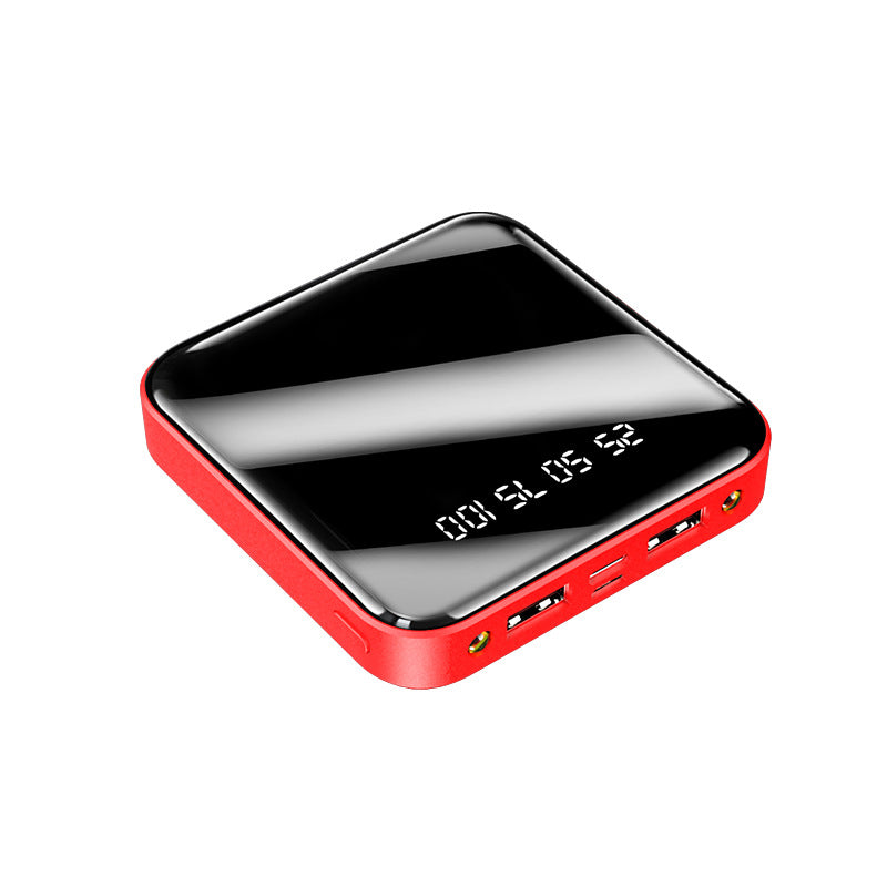 Red electronic device with a reflective black surface on a white background