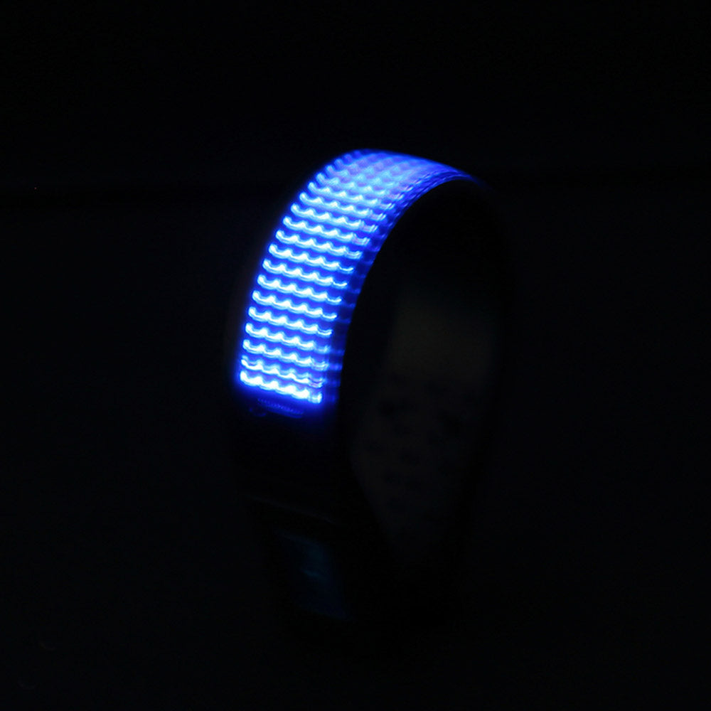 Blue LED wristband glowing in the dark