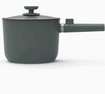 Green saucepan with a handle on a white background