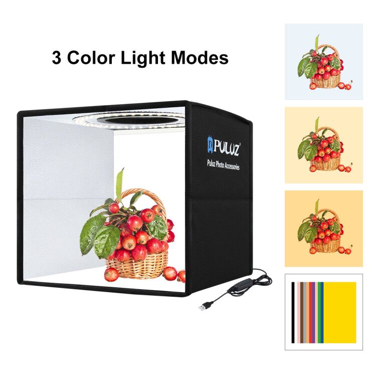 PULUZ photo studio light box with a basket of apples and color mode options on a white background.
