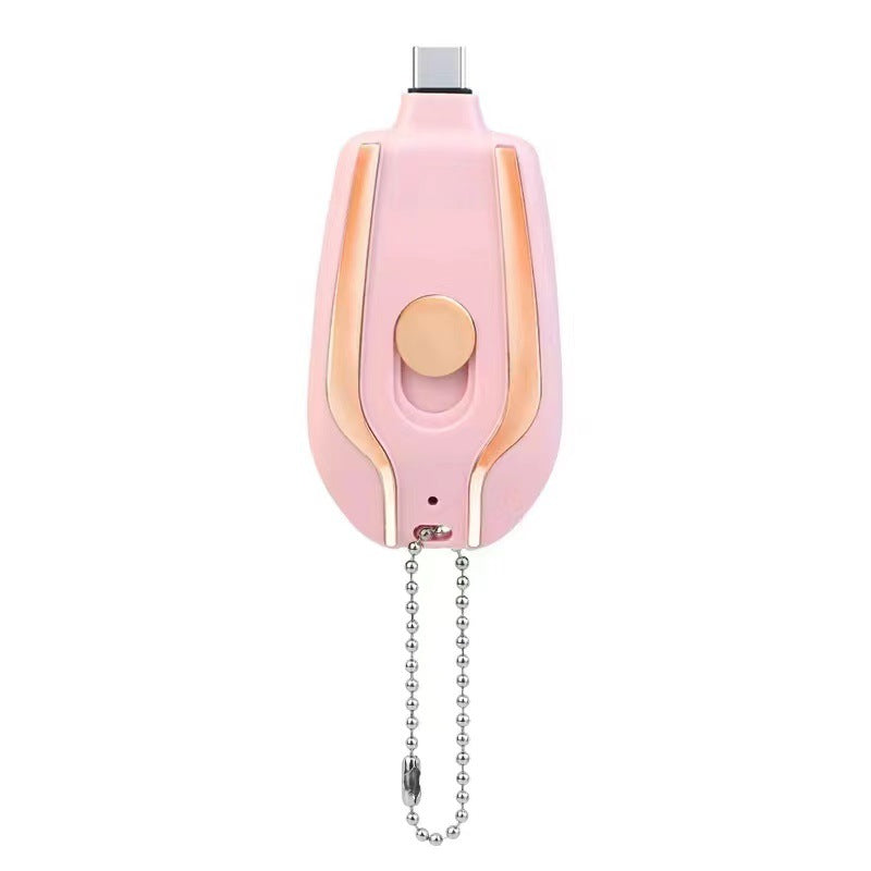 Pink and gold electronic device with a chain on a white background