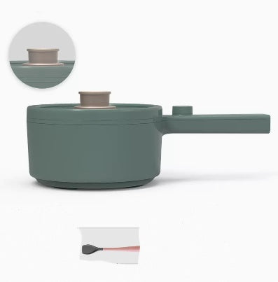 Green cooking pot with handle on a white background