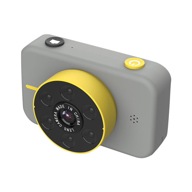 Small camera with gray body and yellow lens on a white background