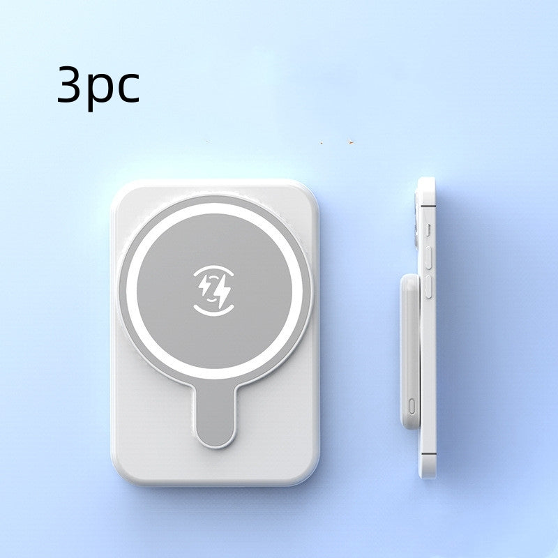 Wireless charging pad with a phone clip on a light blue background