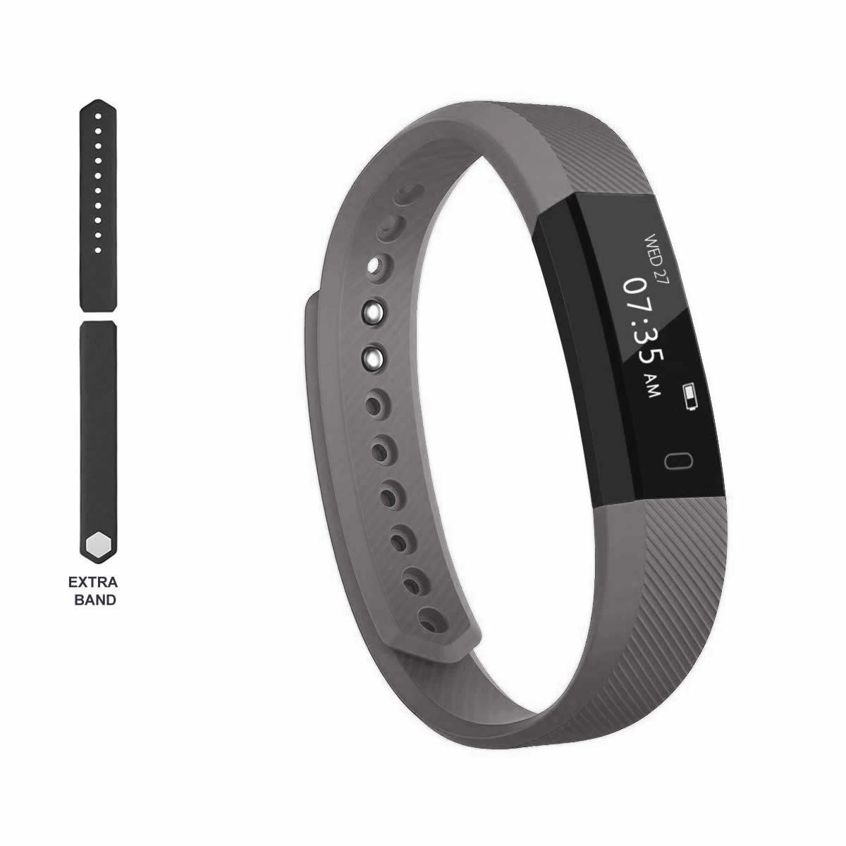 Gray fitness tracker with digital display and an extra band on a white background