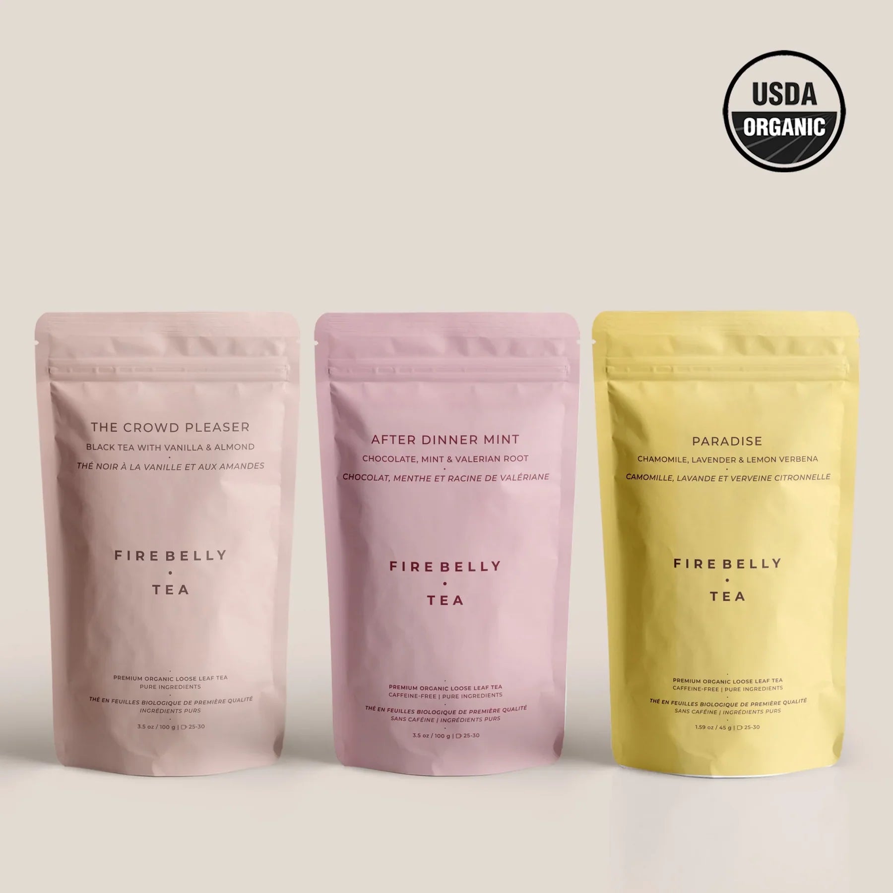 Three Fire Belly Tea packages with labels on a light background, featuring the USDA Organic logo.