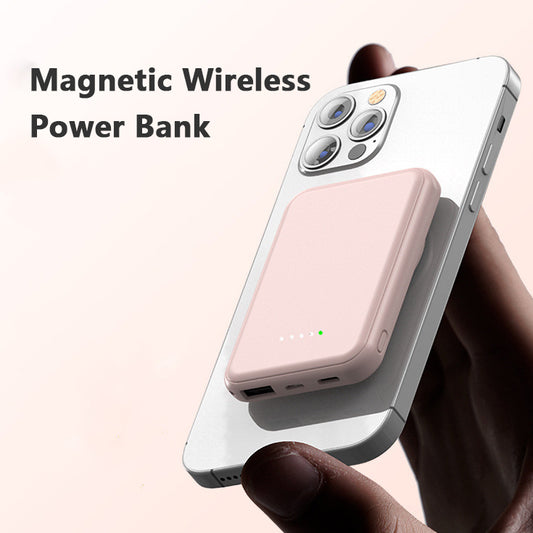 Pink magnetic wireless power bank attached to a smartphone