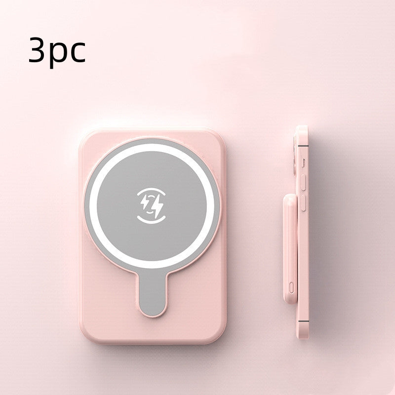 Pink wireless charging pad with a smartphone on a light pink background