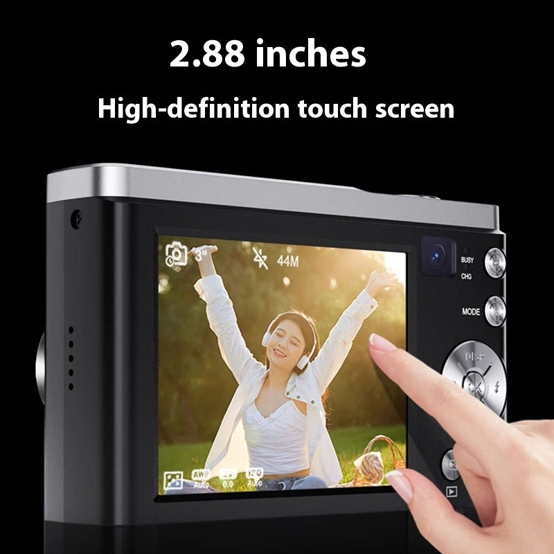 Digital camera with a 2.88-inch high-definition touch screen displaying a person in a field.