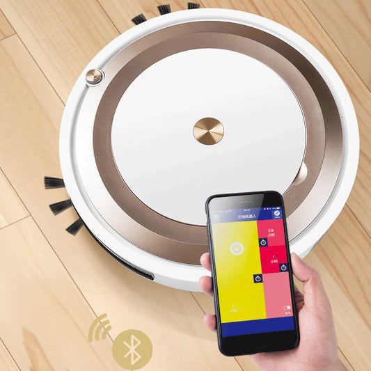 Robotic vacuum cleaner on a wooden floor with a smartphone displaying app controls.