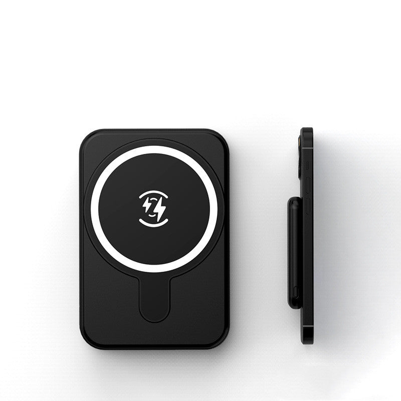 Black wireless charging pad with a logo on a white background